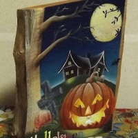 お客様の作品「骨董品屋さんに埋もれていたハロウィンの本」～銘木桑一枚板トールペイント～